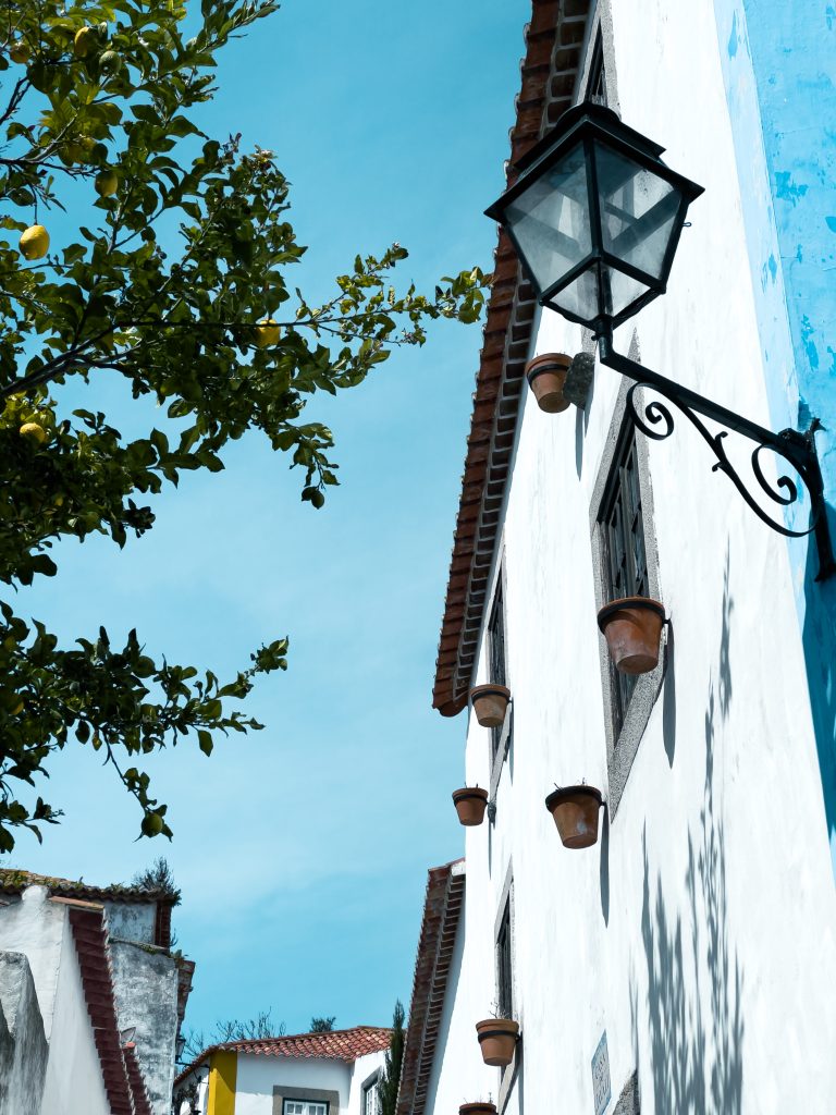Street photo in Óbidos, Portugal by Alexander Ruiz