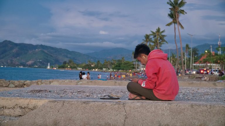 Street photo in Dili, Timor-Leste by Lei Sun