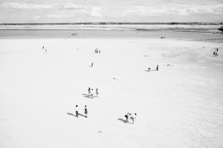Street photo in Mont Saint-Michel, France by Sivert Almvik