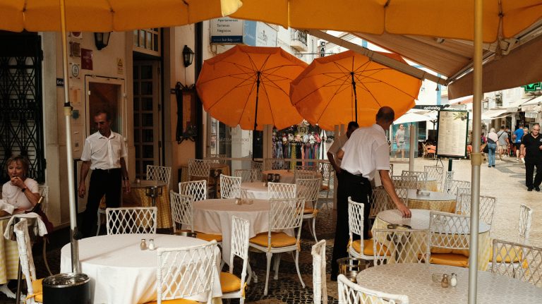 Street photo in Lagos, Portugal by Samual Shears