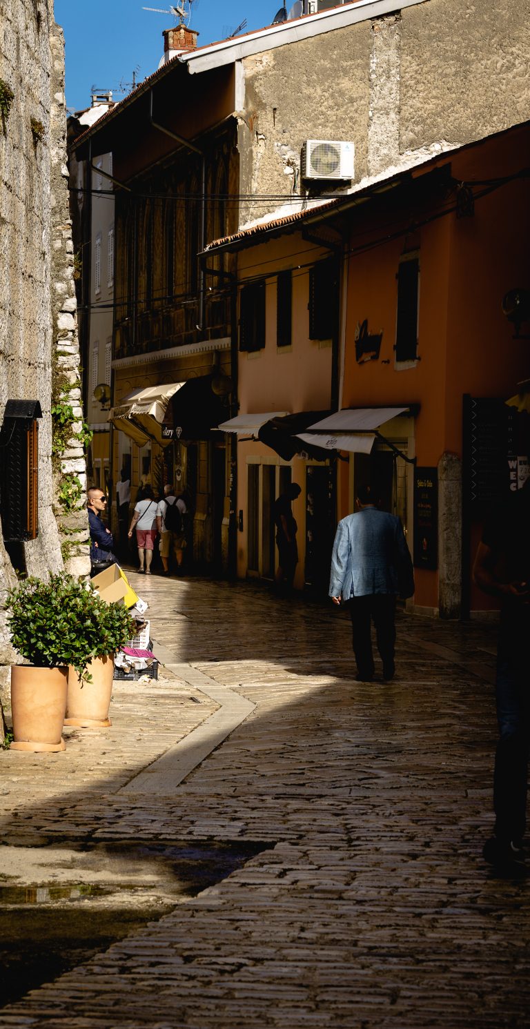 Street photo in Poreč, Croatia by Alex Jeske