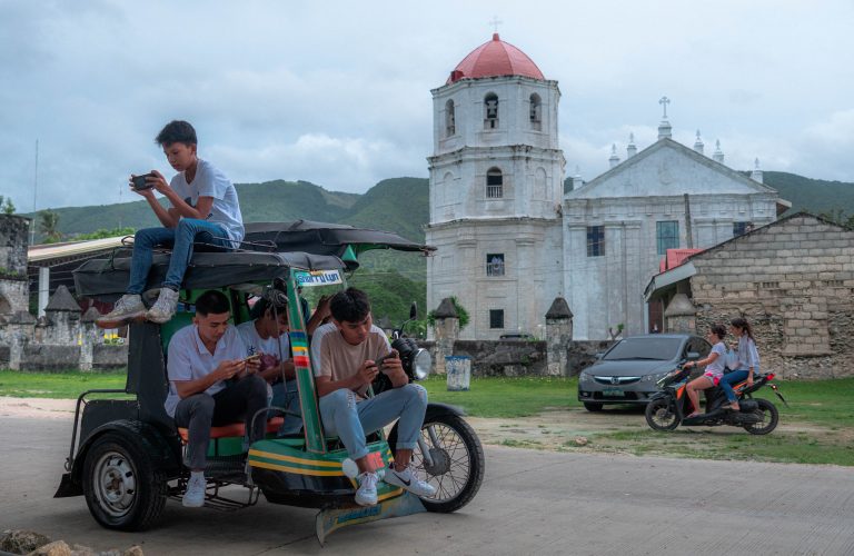Street photo in Oslob, Philippines by Trevin Blount
