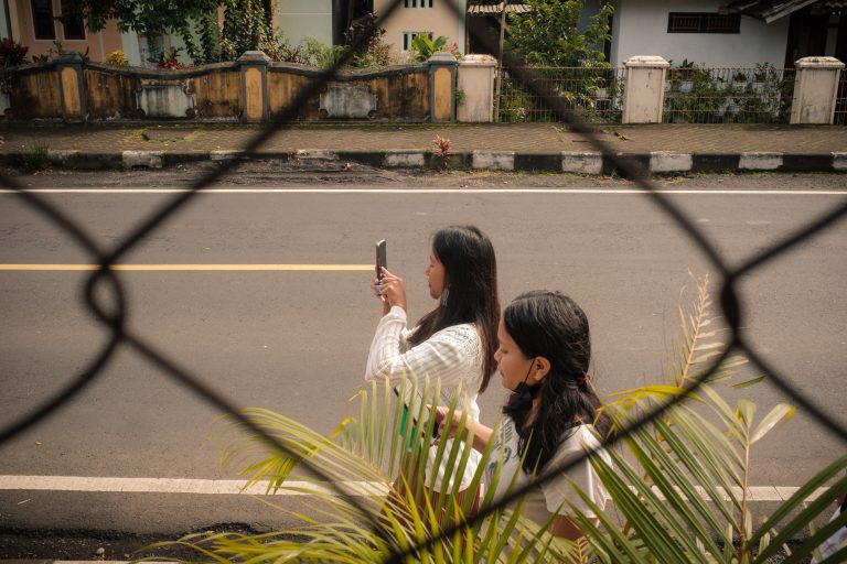 Street photo in Manado, Indonesia by Chris Batis