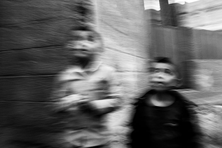 Street photo in San Antonio Palopó, Guatemala by Duncan Aitken