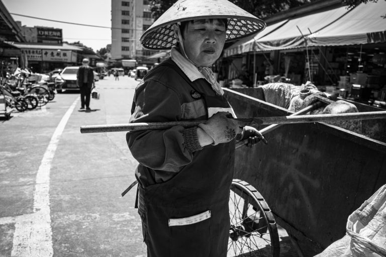 Street photo in Jiang Tai Lu, China by Craig Meakin
