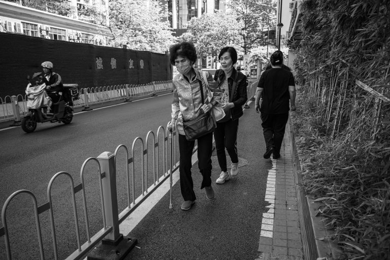 Street photo in Jiang Tai Lu, China by Craig Meakin