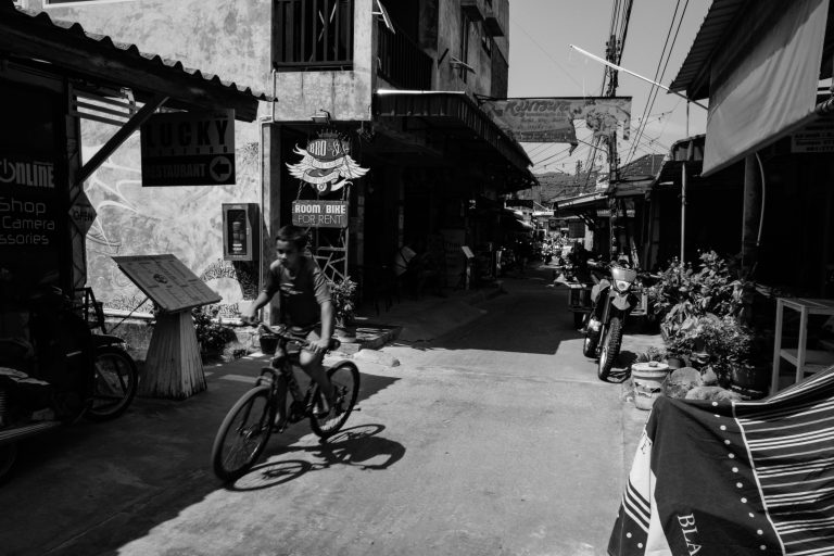 Street photo in Surat Thani, Thailand by Aleksei Korzov