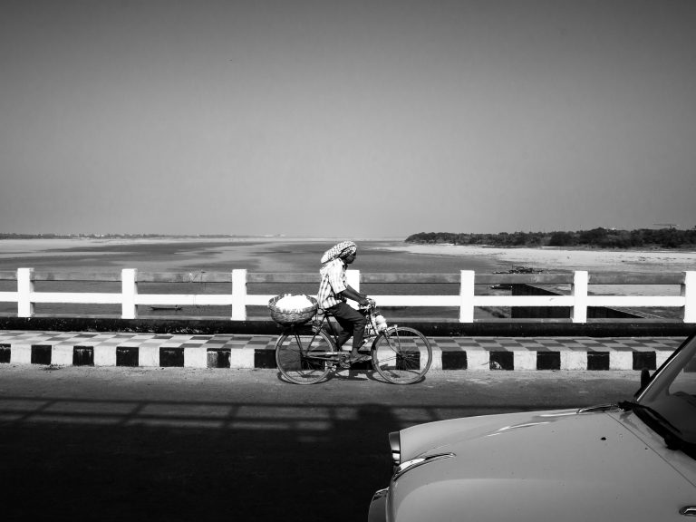 Street photo in Kuakhai River, India by Rushav Mohanty