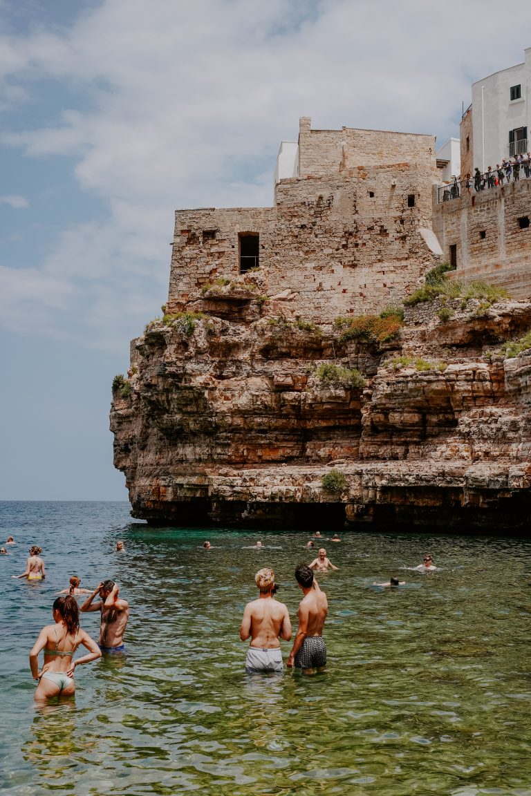 Street photo in Polignano a Mare, Italy by Alex Pler