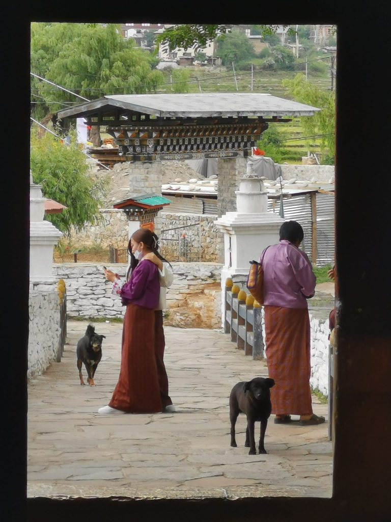 Street photo in Thimphu, Bhutan by Nik TAN