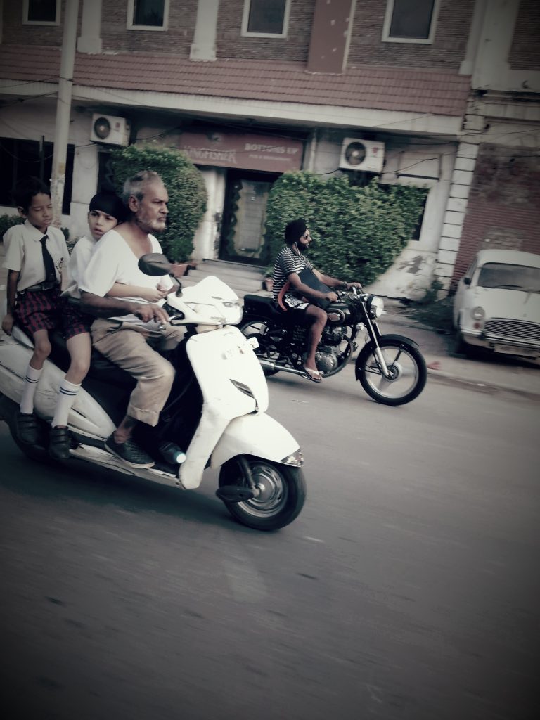 Street photo in Dharamshala, India by Nik TAN