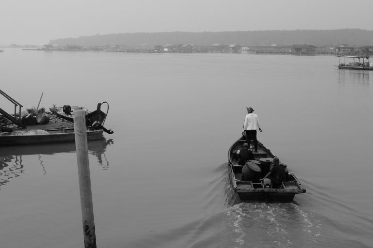 Street photo in Kukup, Malaysia by Zhi Hoong Yeap
