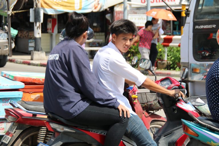 Street photo in Mae Klong, Thailand by Nik TAN