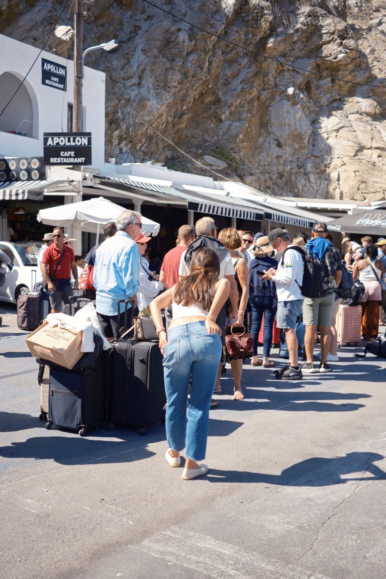 Street photo in Fira, Greece by John Lanagan