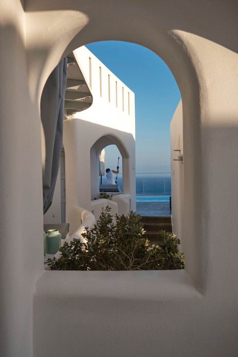 Street photo in Fira, Greece by John Lanagan