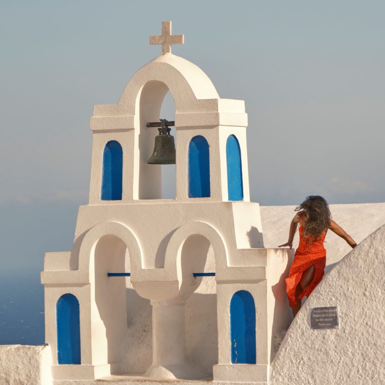 Street photo in Fira, Greece by John Lanagan