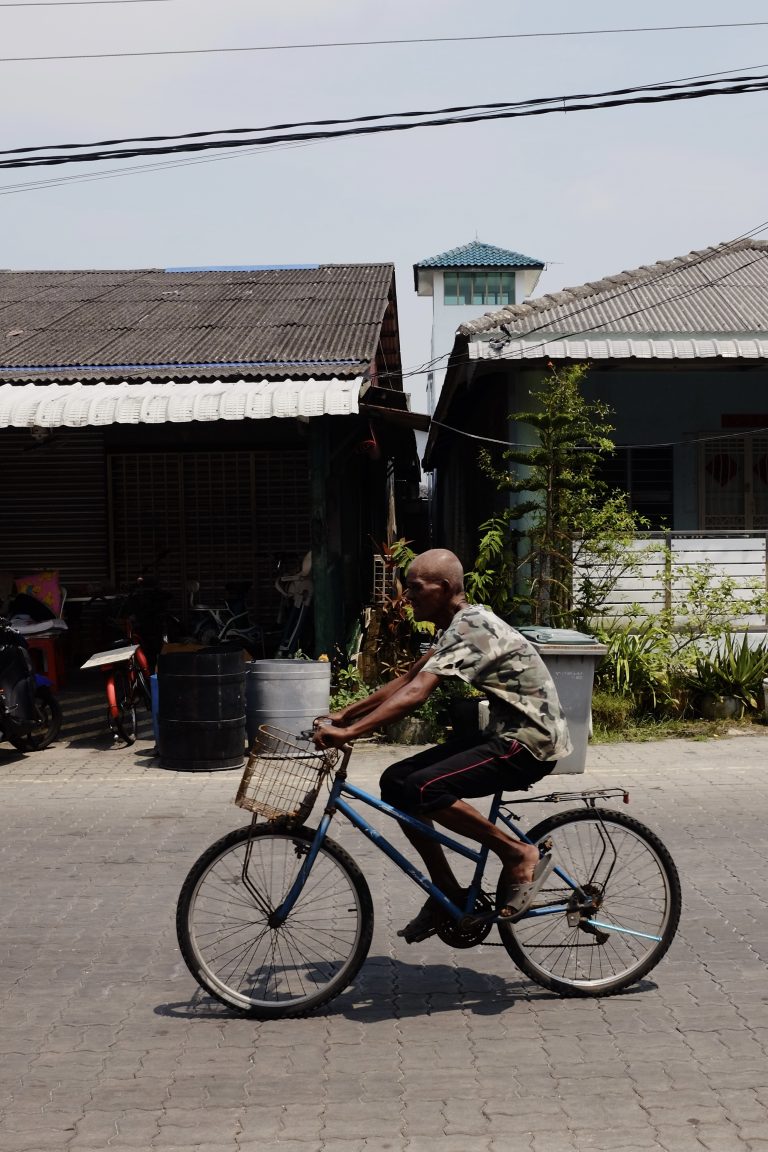 Street photo in Kukup, Malaysia by Zhi Hoong Yeap