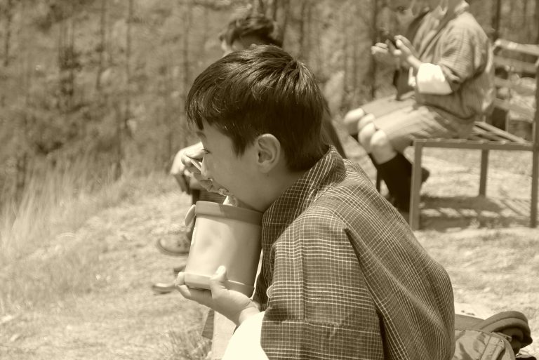 Street photo in Thimphu, Bhutan by Nik TAN