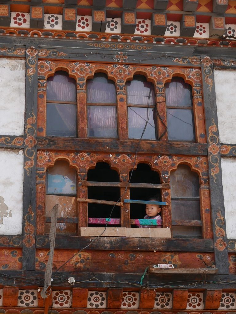 Street photo in Thimphu, Bhutan by Nik TAN