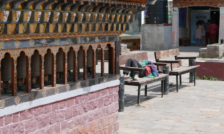 Street photo in Thimphu, Bhutan by Nik TAN