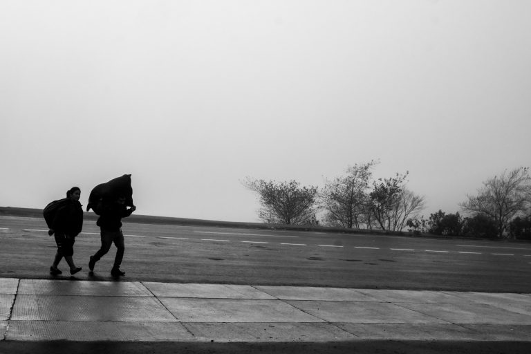 Street photo in Los Encuentros, Guatemala by Duncan Aitken