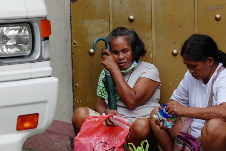 Street photo in Manila, Philippines by Tata Yap