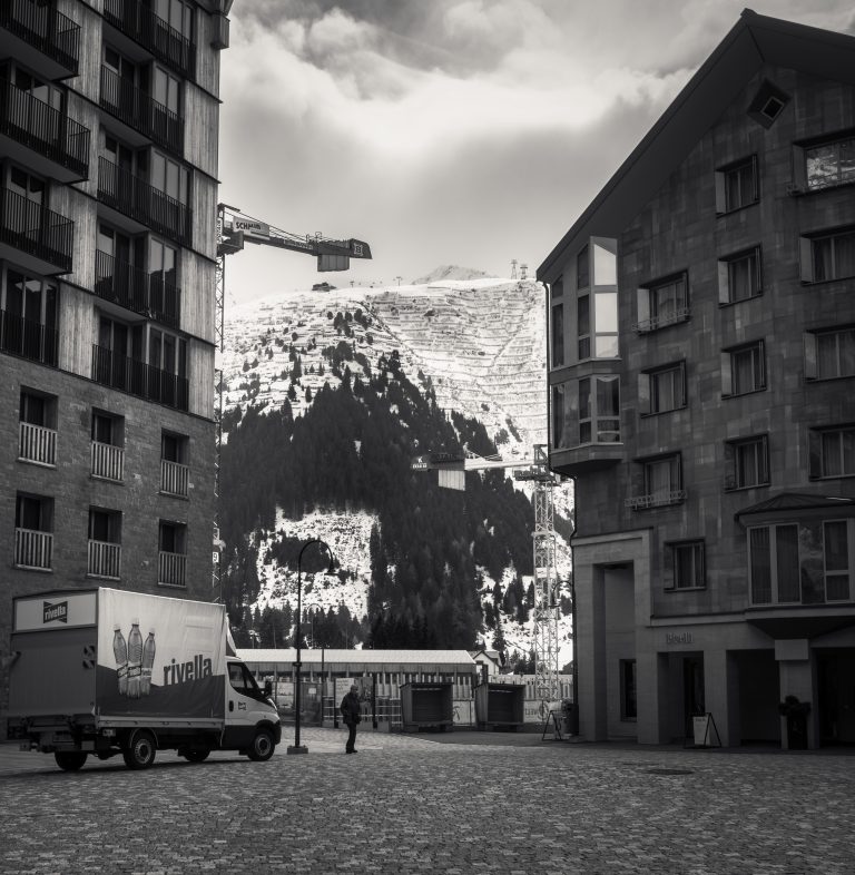Street photo in Andermatt, Switzerland by Tim Hartelt