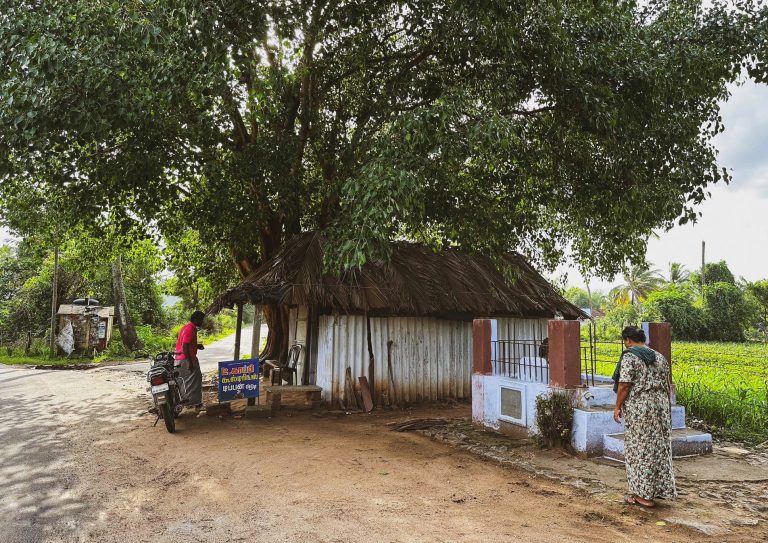Street photo in Ozhalapathy, India by EM Rajeev