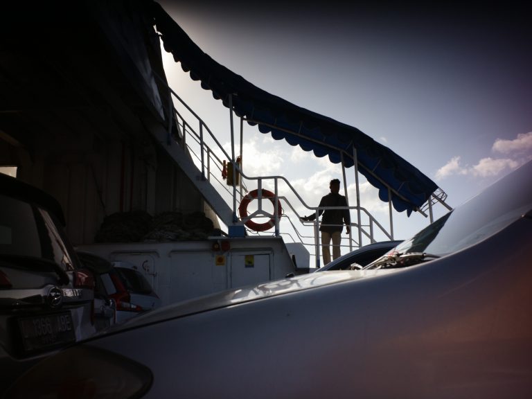 Street photo in Bali Strait, Indonesia by Kadek Windhu
