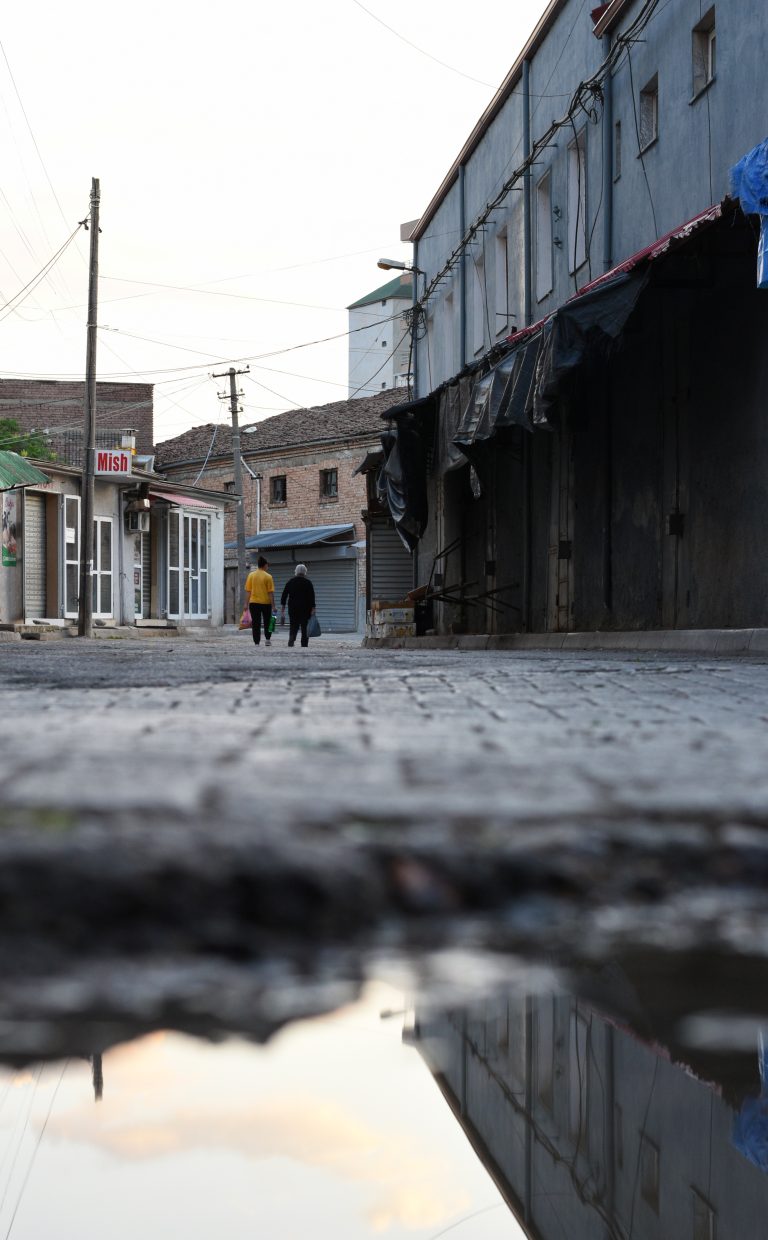 Street photo in Korçë, Albania by Rodrigo Marcotich
