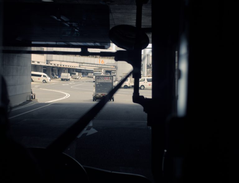 Street photo in Naha, Japan by Satoshi Osuga