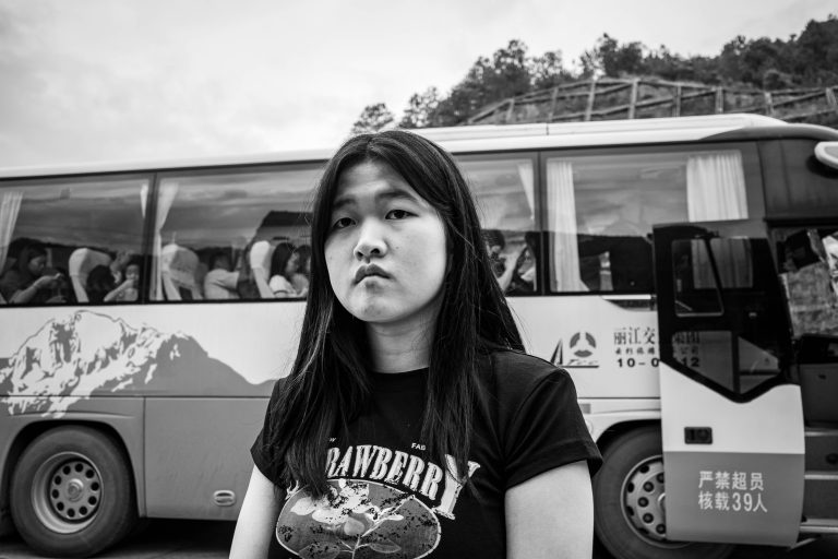 Street photo in Lijiang, China by Craig Meakin