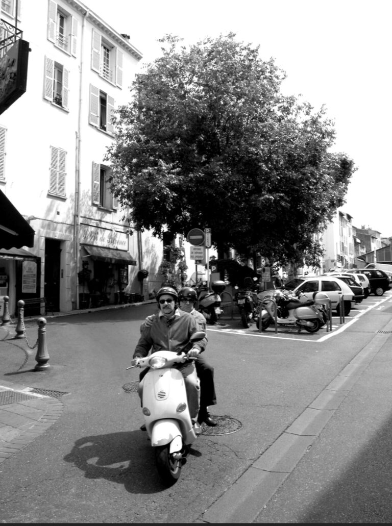 Street photo in Antibes, France by William Black