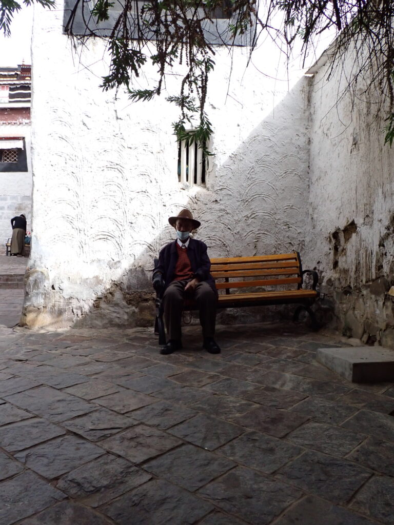 Street photo in Shigatse, China by Nik TAN