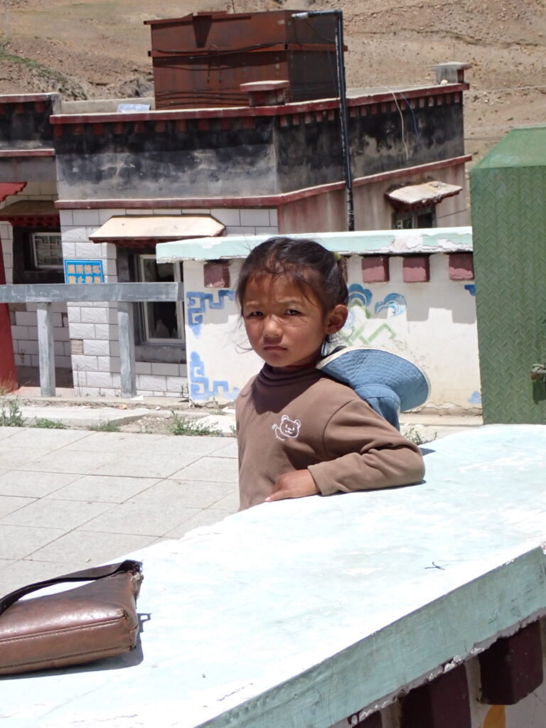 Street photo in Shigatse, China by Nik TAN